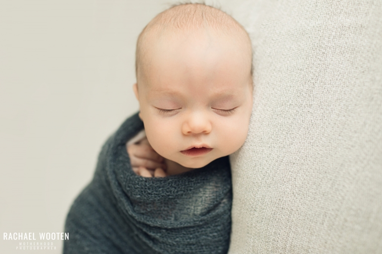 Lifestyle newborn photography session in the home with a mom, dad, and two month old baby in Denver, Colorado.